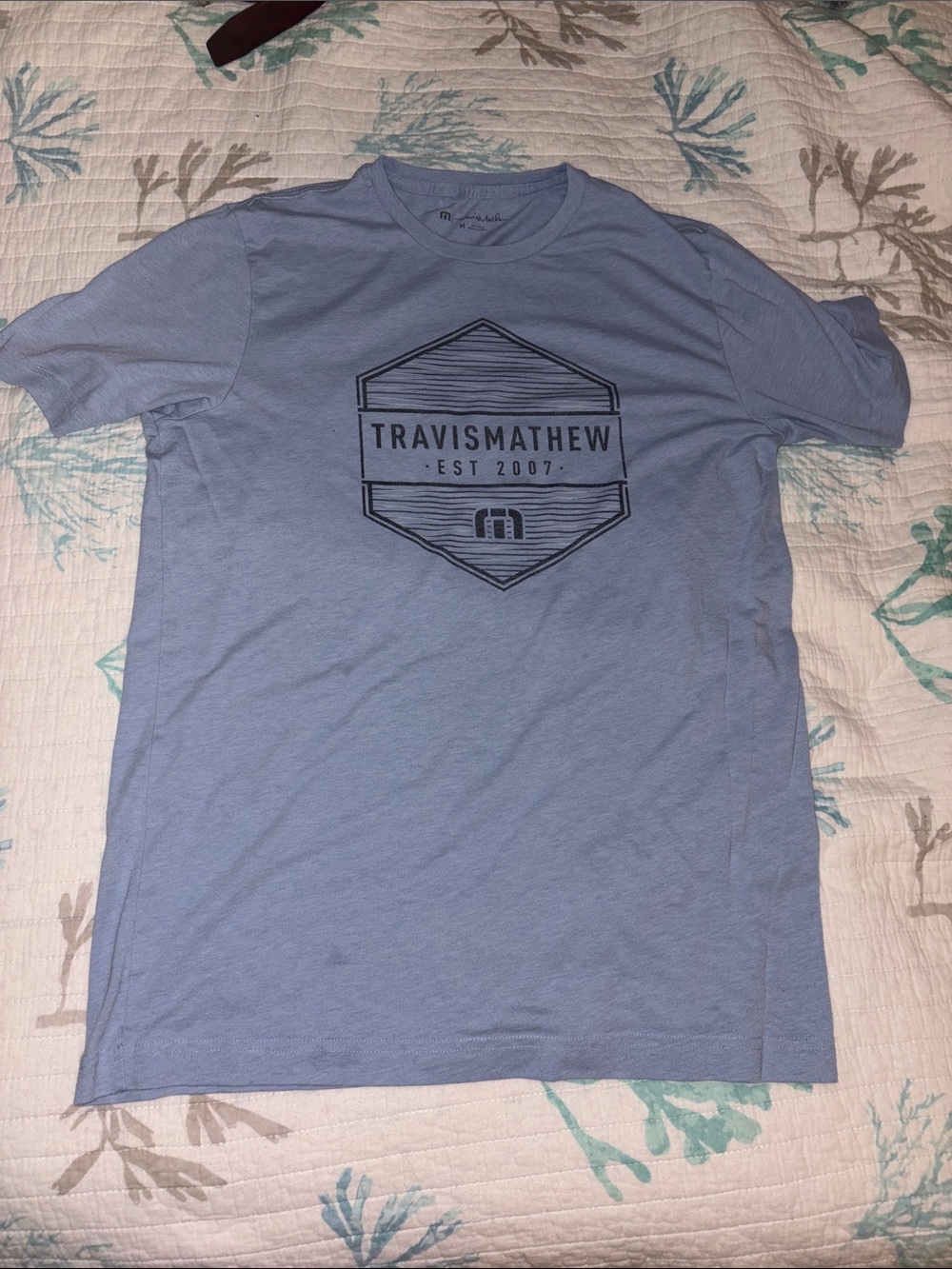 Travis Mathew Men's Pale Blue Logo Short Sleeve Tee
